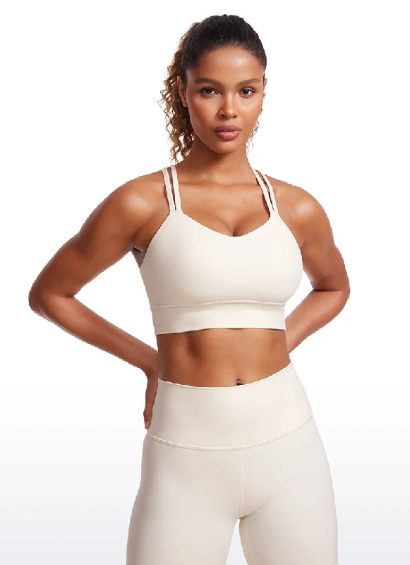 Bra with a quarter - cup design for a very revealing style Butterluxe Molded cups Criss Cross Sports Bra Bra with a quarter - cup design for a very revealing style Butterluxe Molded cups Criss Cross Sports Bra