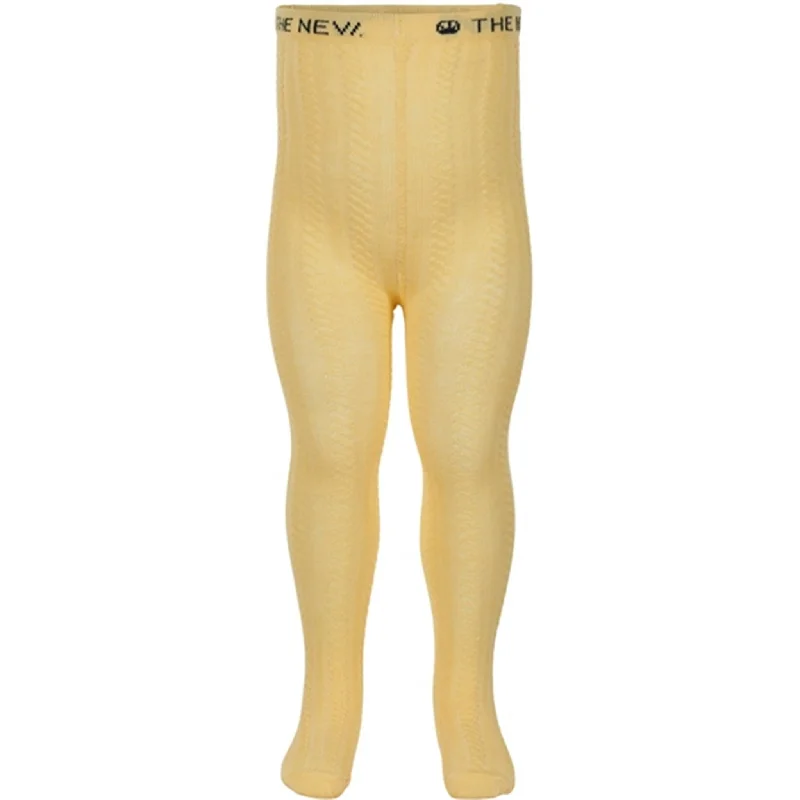 women tights with a holographic effect for a futuristic styleThe New Siblings Lemonade Addi Cable Tights